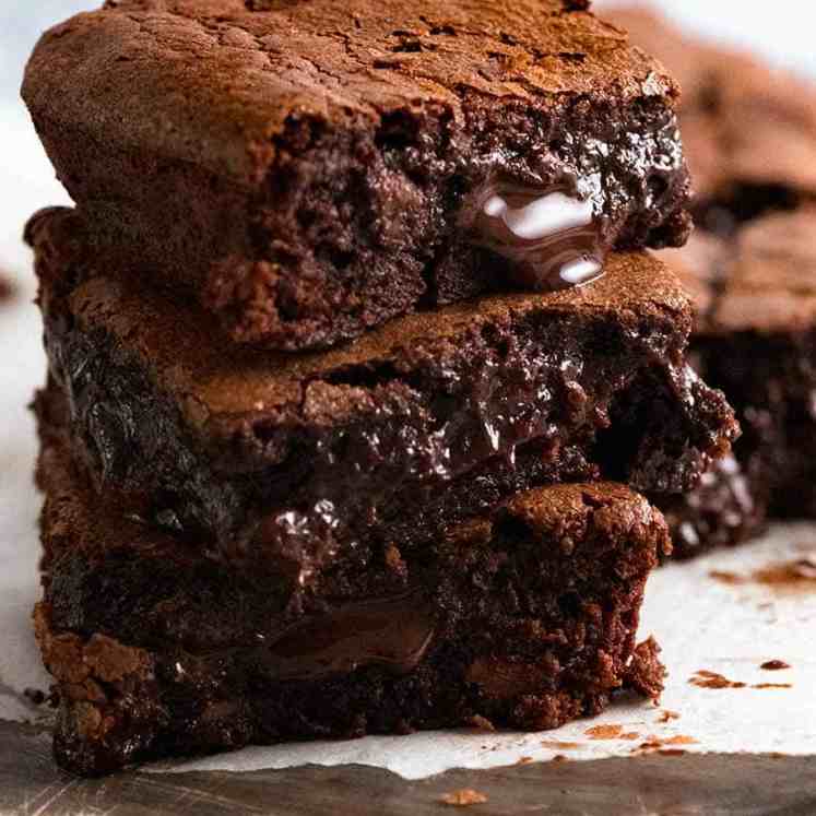 Close up photo of stack of ultra fudgy chocolate brownies