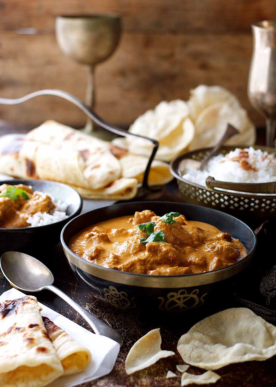 Butter Chicken dinner menu with papadums, naan and basmati rice