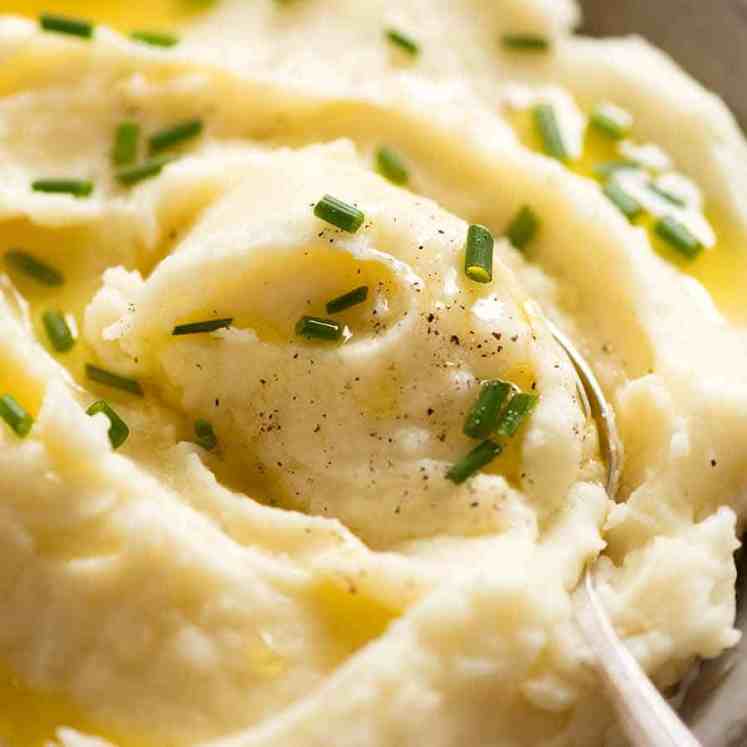 Close up of spoon scooping up Mashed Potato