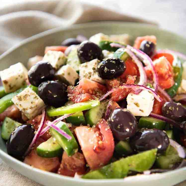 A classic Greek Salad with plump olives and a beautiful homemade Greek Salad Dressing. www.recipetineats.com