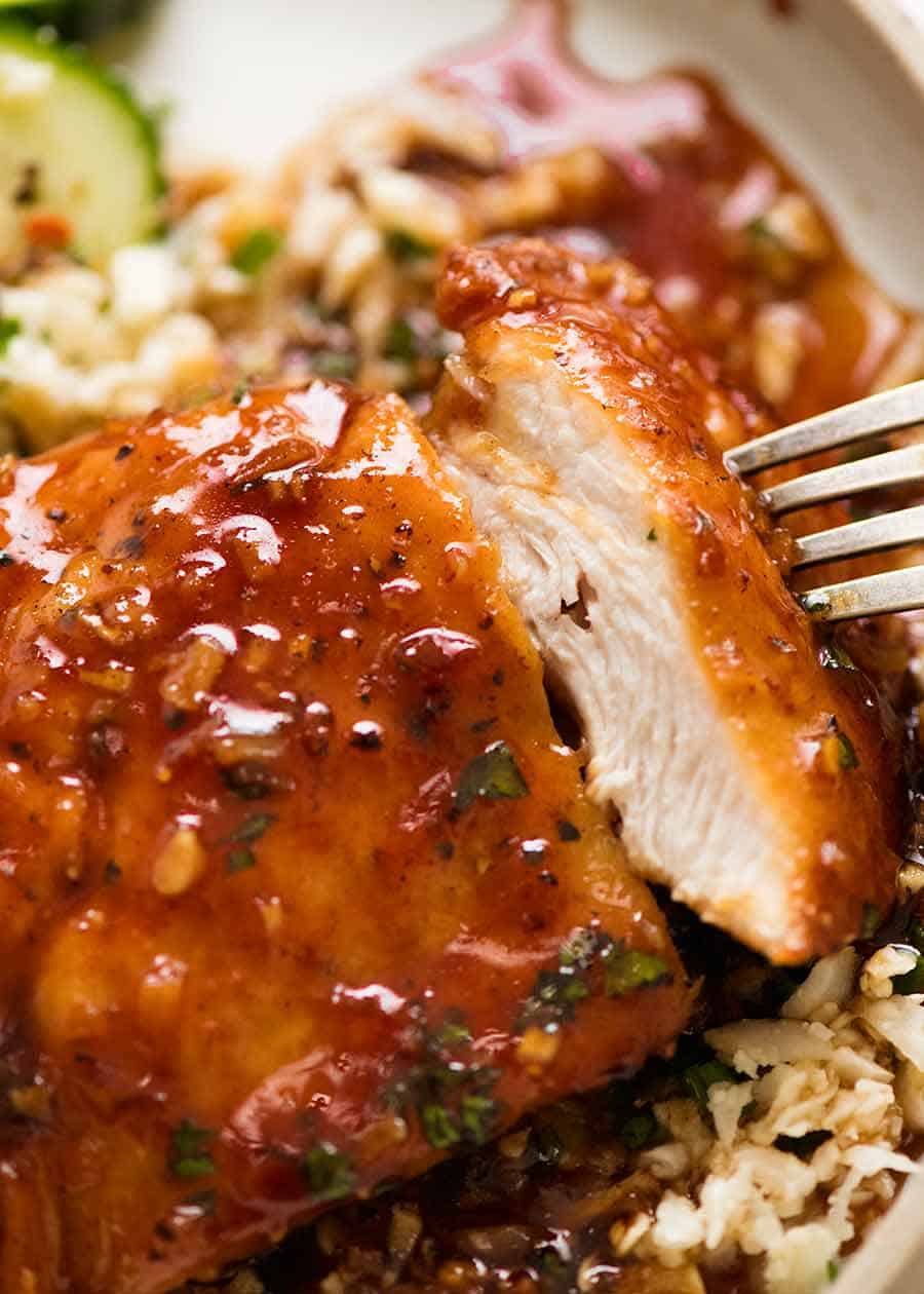 Close up showing inside of juicy chicken breast with Honey Garlic Sauce