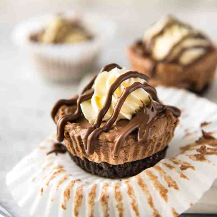 No Bake Nutella Cheesecake - Mini ones made in a muffin tin! A biscuit base and light mousse-like Nutella flavoured cheesecake. Easy to make and completely irresistible! www.recipetineats.com