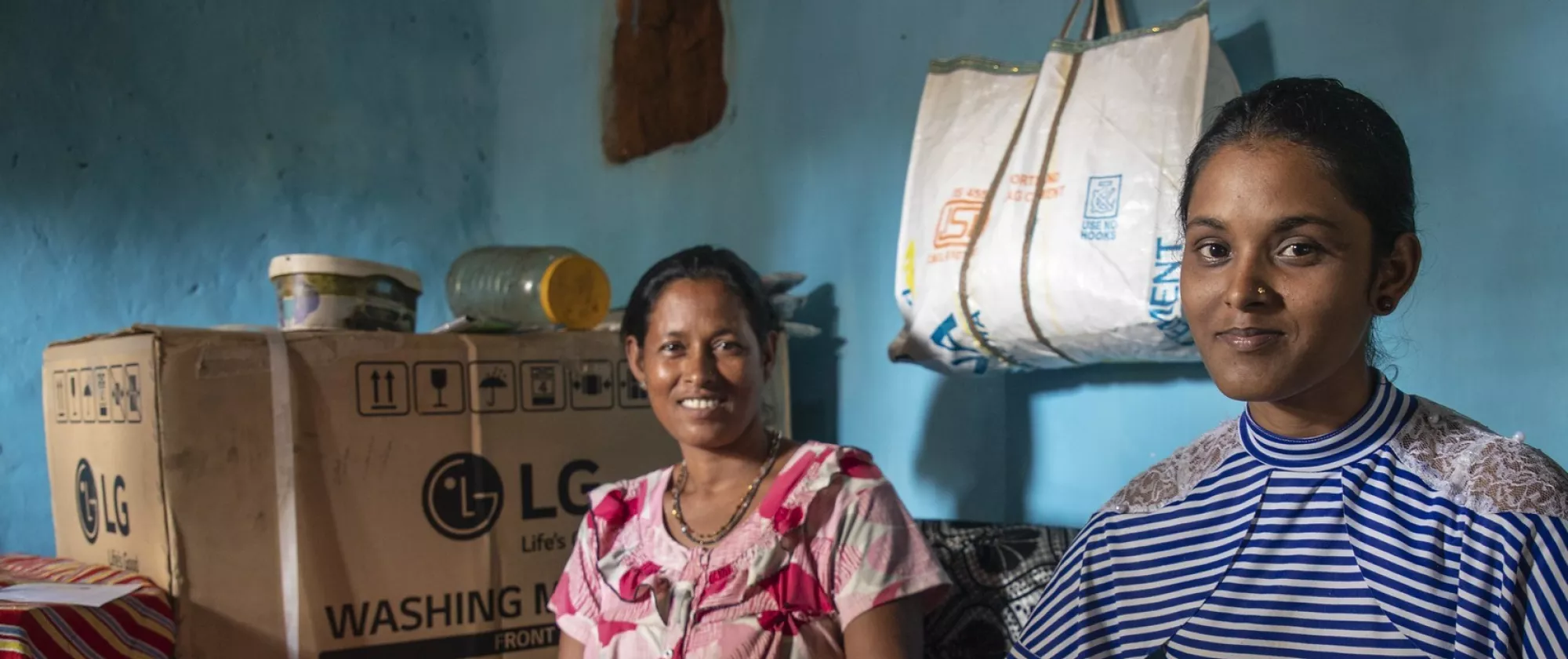 Mother and daughter sitting together in their home