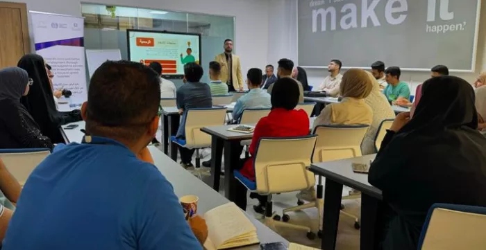 a group of students attending a training in a class