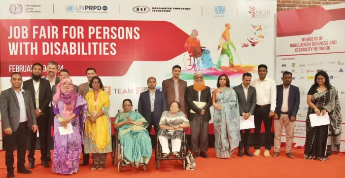 Organizers and participants of a job fair for persons with disability pose for a photo