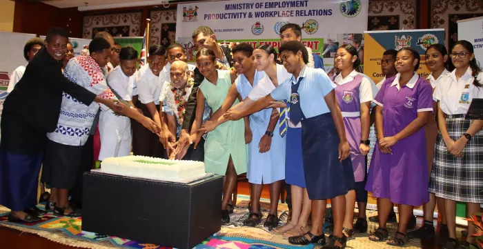 Cutting the cake to celebrate the launch of the Student Employment Exposure Program