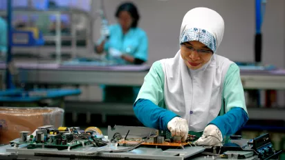 Female electronics factory worker, Cikarang, Indonesia.