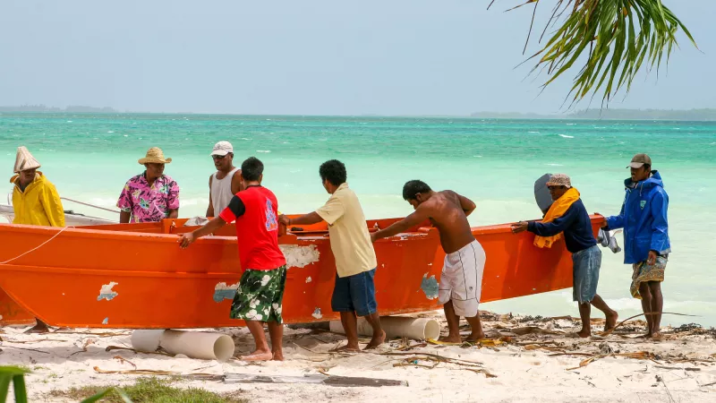 A group of men coming back from fishing at Tabuaeran Island of the Republic of Kiribati