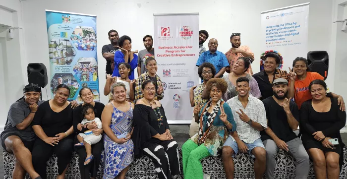 Training participants gather for a group photo