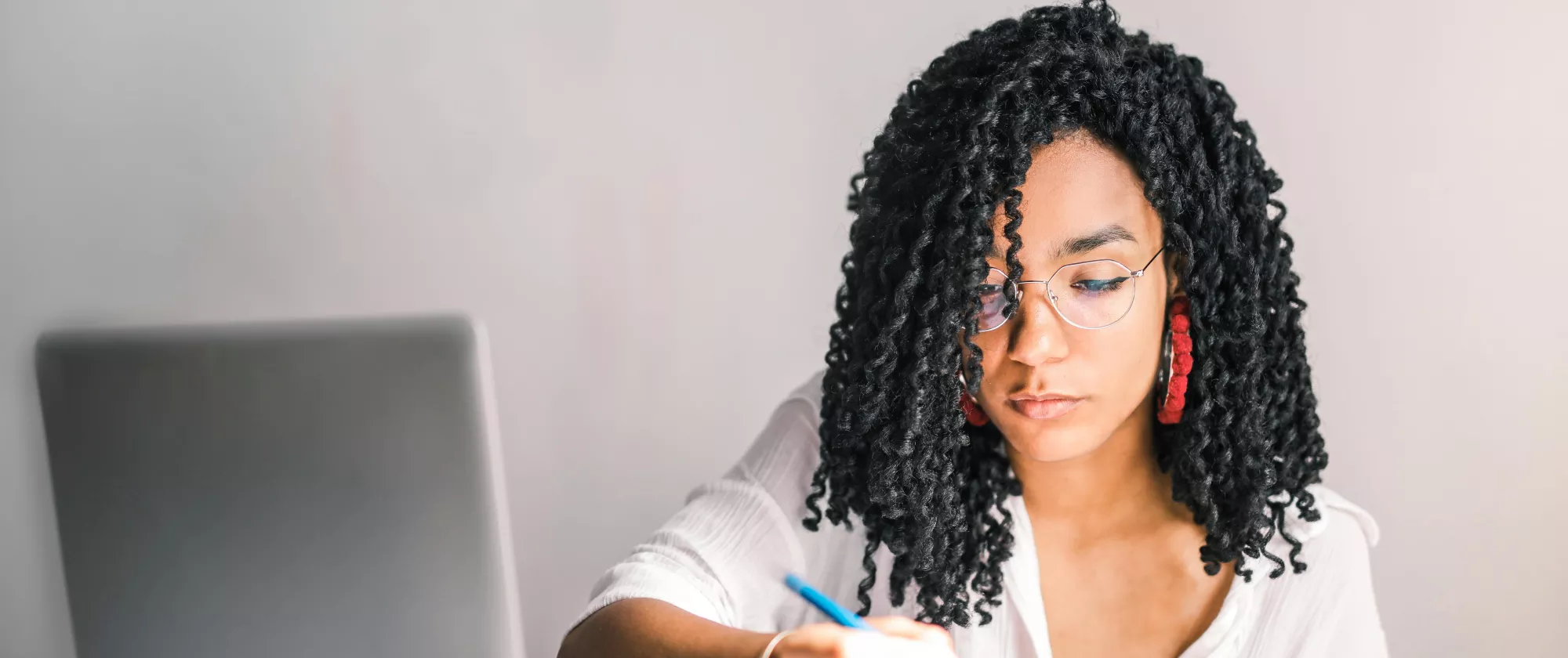 woman writing in notebook