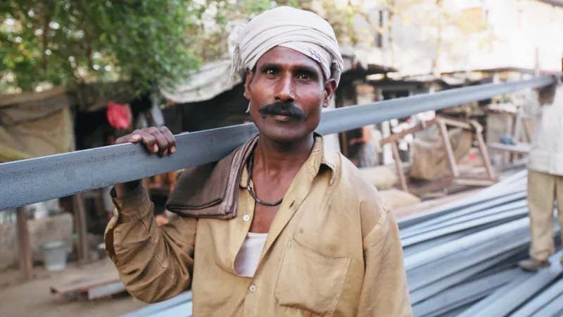 Porters working in the metal market in India.