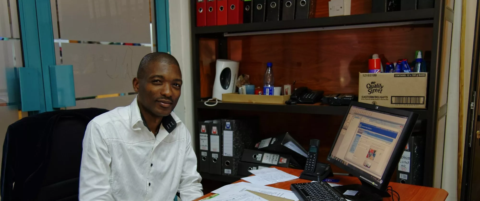 Portrait of an office worker at his desk.