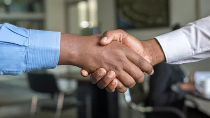 Handshake between two persons.