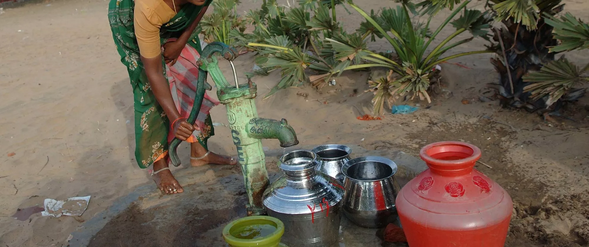 A woman is fetching water.