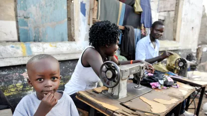 Young workers sewing up clothes in the streets of Kisumu in Kenya ILO photo e54763